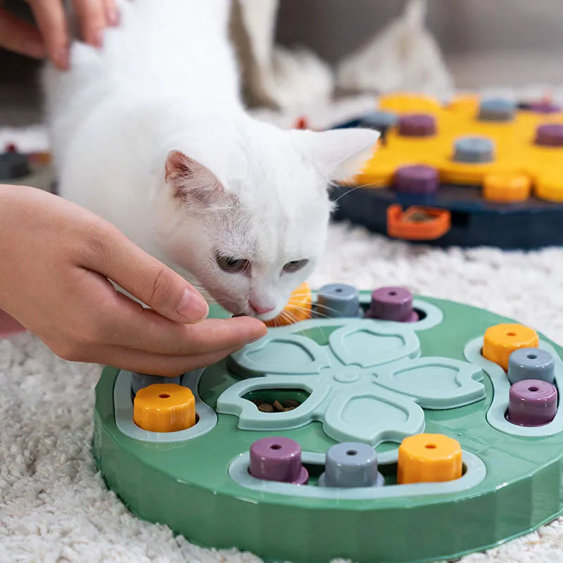 Blue interactive slow feeder dog bowl with puzzle channels, 28 cm diameter, on a wooden floor.