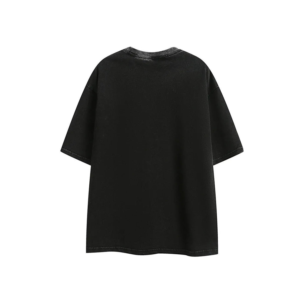 Man's purple loose-fit cotton t-shirt with a retro embroidered design on the chest.