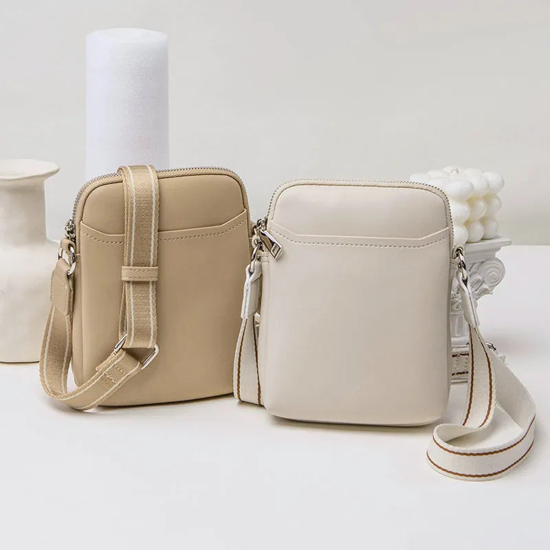 Solid colour small crossbody shoulder bag for mobile phones in beige.