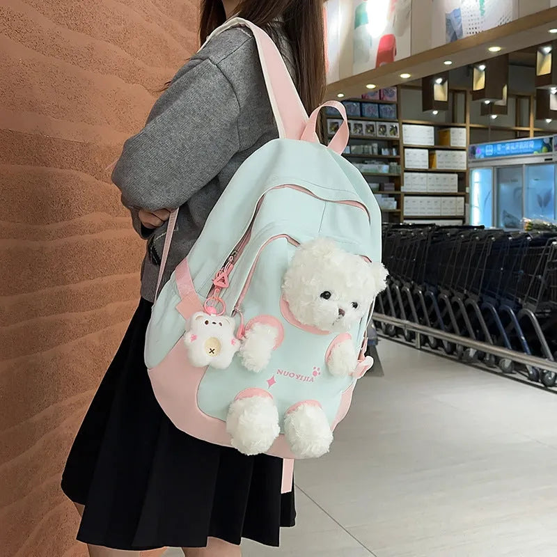 Nylon school backpack in a macaron colour with curved shoulder straps and sewing line detail.
