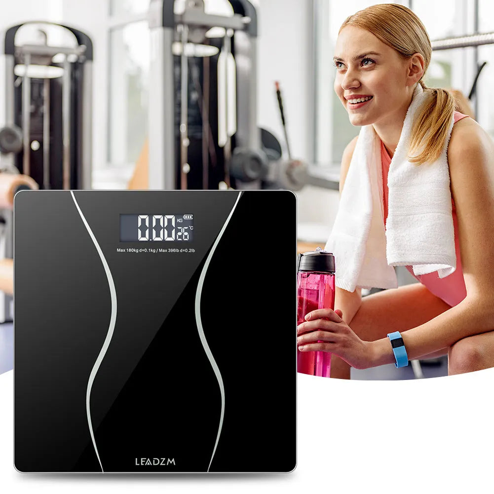 Black electronic household scale with digital display for weight measurement up to 180kg
