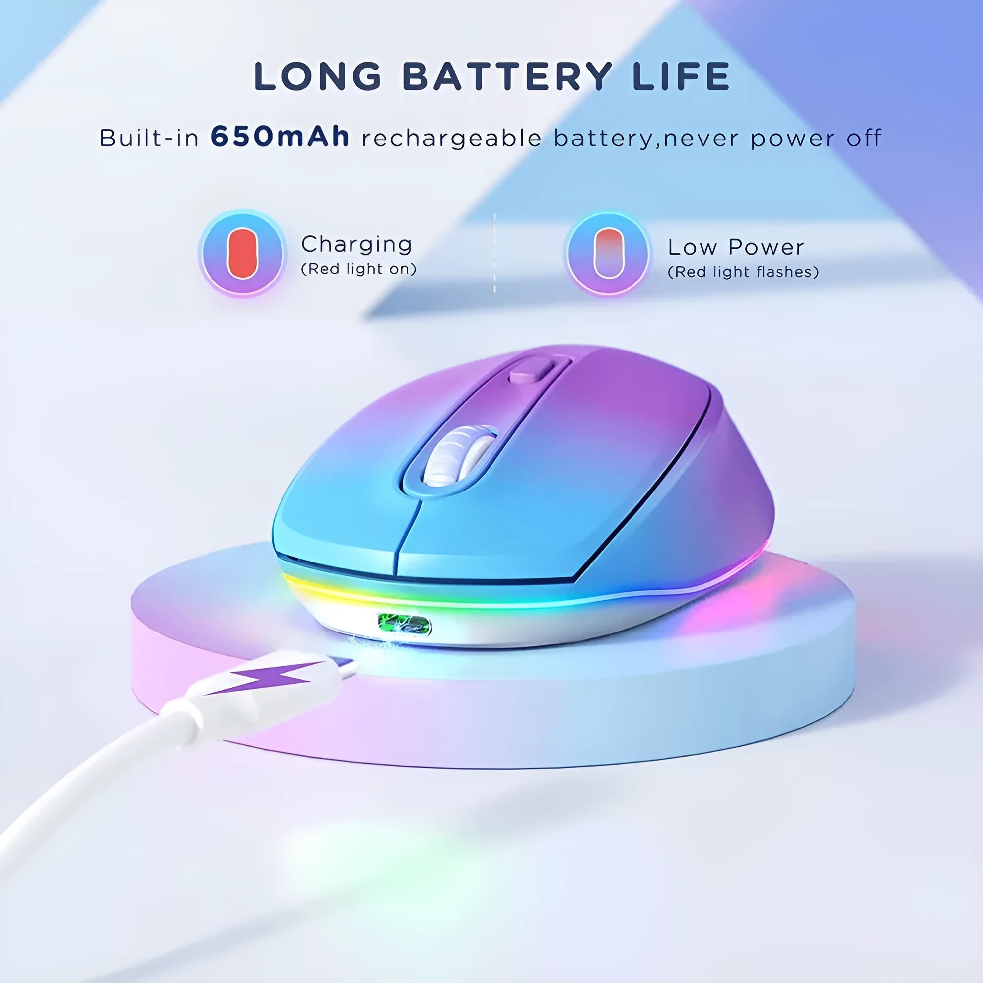 Light grey wireless ergonomic mouse with USB charging cable on a wooden desk.