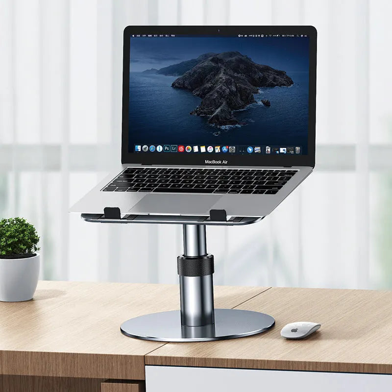Silver aluminium car laptop stand with height adjustment and 360-degree rotating base on a car seat.