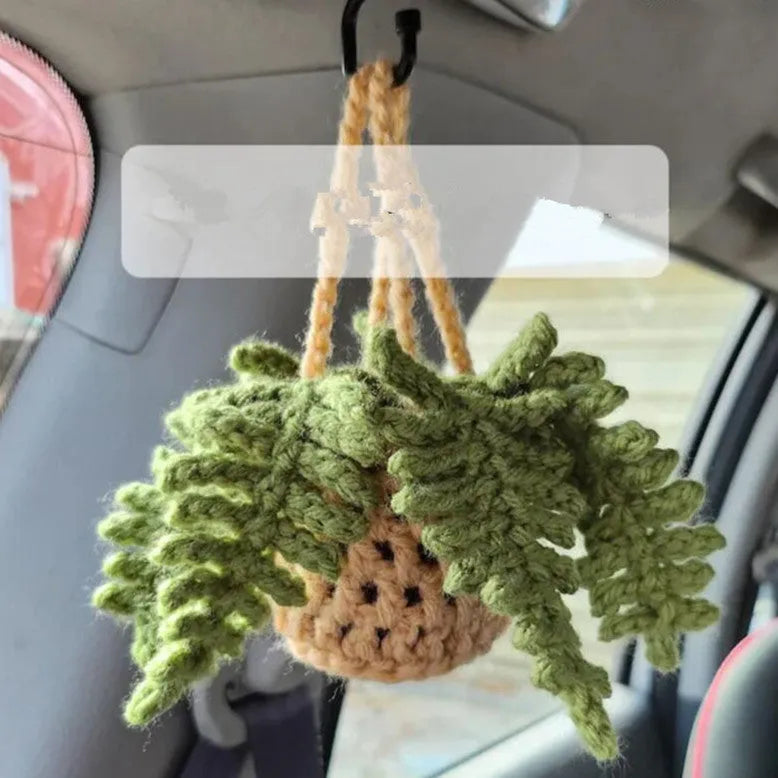 Green and white knitted wool plant ornament for car dashboard with hanging cord