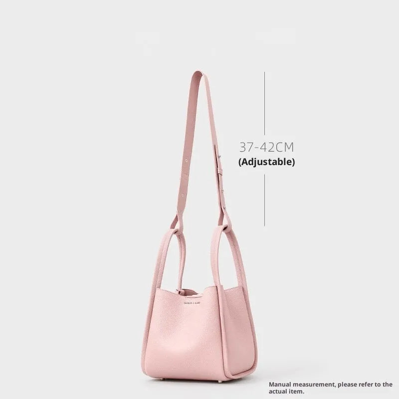 Genuine leather bucket shoulder bag for women, 20x16x19cm, pink colour, with sewing thread and lock detail