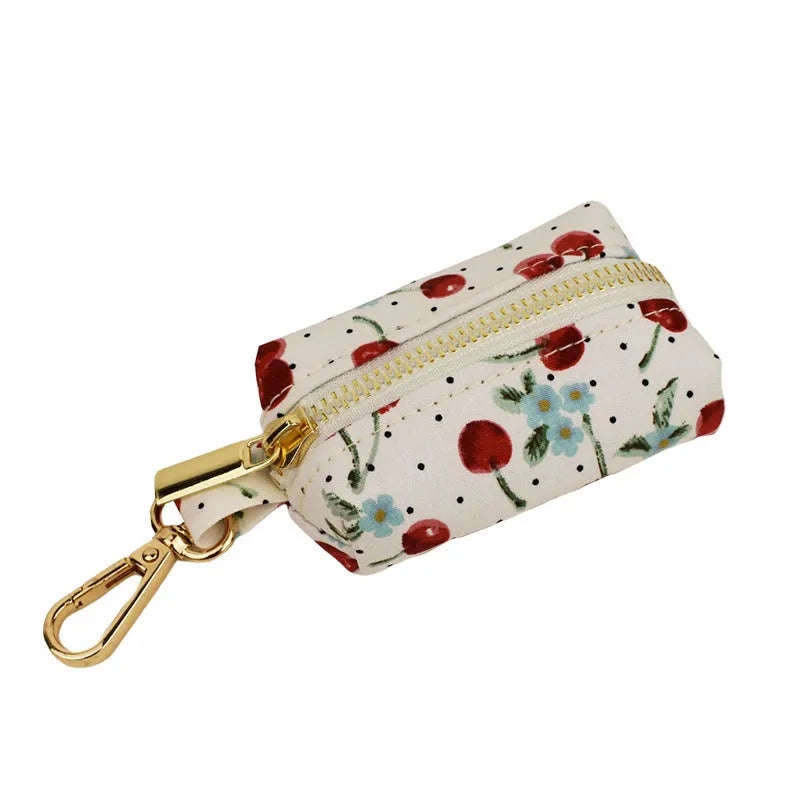 Red cherry print dog collar and leash set with light gold metal buckle and attached cloth bow