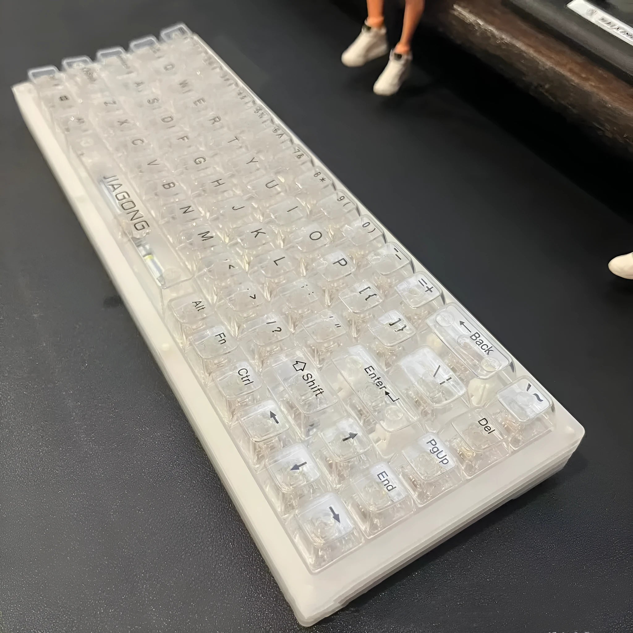 Transparent plastic 132-key mechanical keyboard cap set displayed in standard layout arrangement