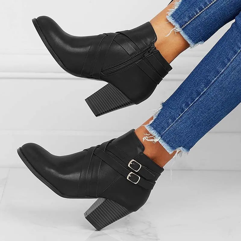 Grey women's plus size ankle boots with a 7cm chunky heel, side zipper, and belt buckle detail.