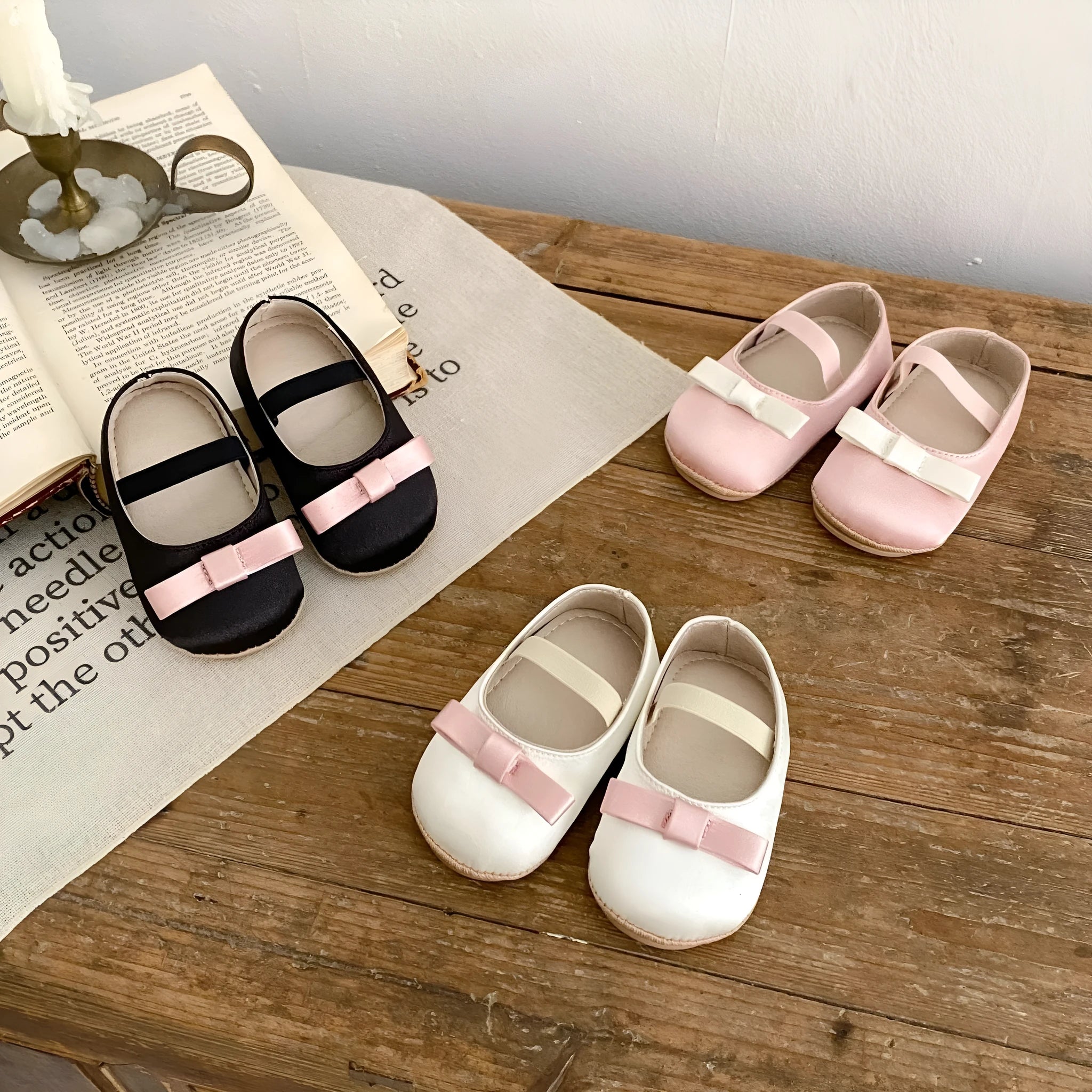 Cute baby butterfly knot shoes in solid colour with bow detail, breathable cloth and rubber sole