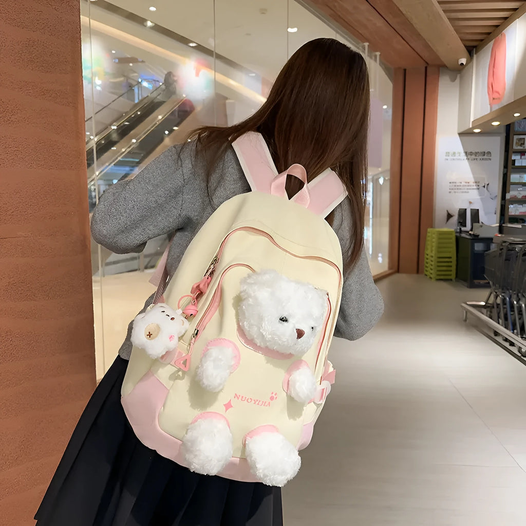 Nylon school backpack in a macaron colour with curved shoulder straps and sewing line detail.