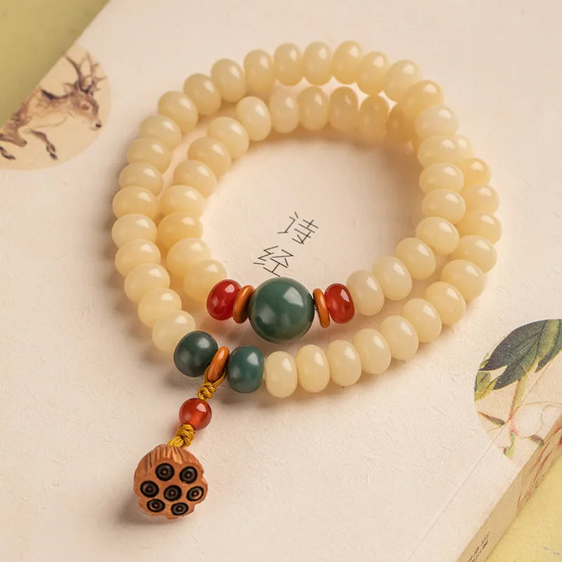 Milk butter coloured Bodhi root wooden bracelet with 6x9mm flat round beads and double ring design