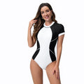 Black and white colour block one-piece swimsuit with short sleeves and back zip, briefs cut, sizes S-XXL