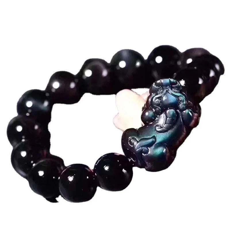 Natural Ice Colour Eye Obsidian crystal bracelet with round beads on an adjustable cord.
