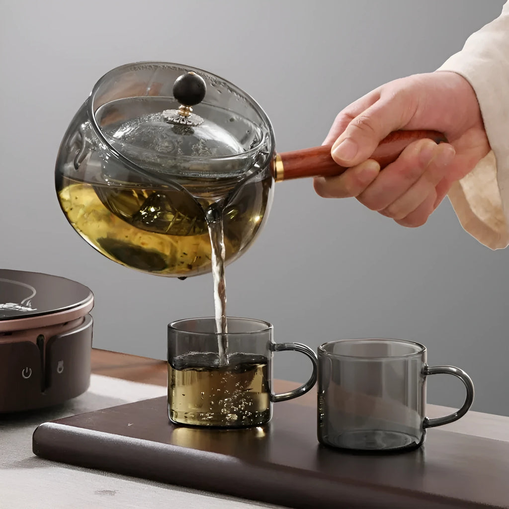 Transparent borosilicate glass teapot with wooden handle and removable infuser for rotary tea brewing