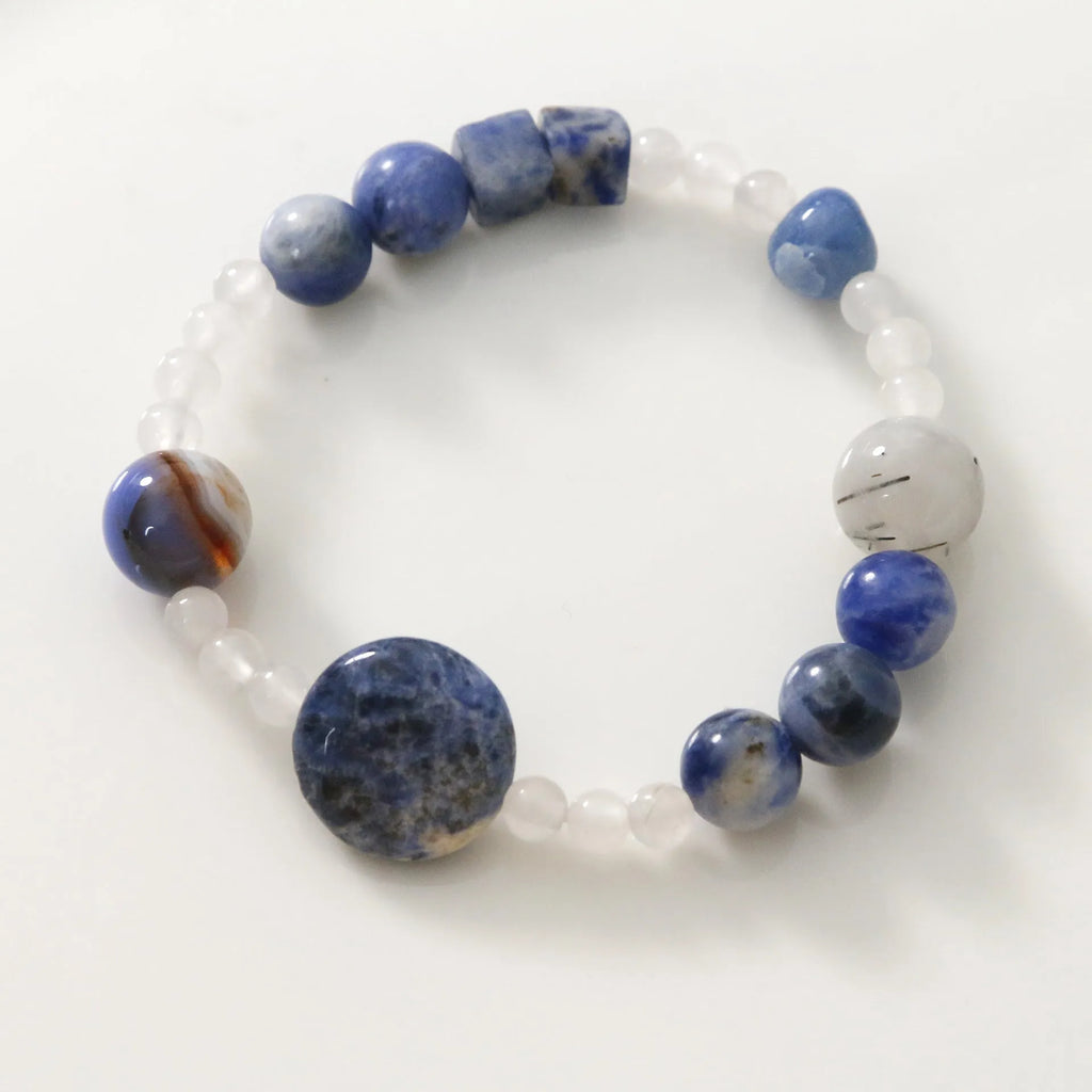Hand-woven natural blue point and black hair crystal agate bracelet with geometric stone elements