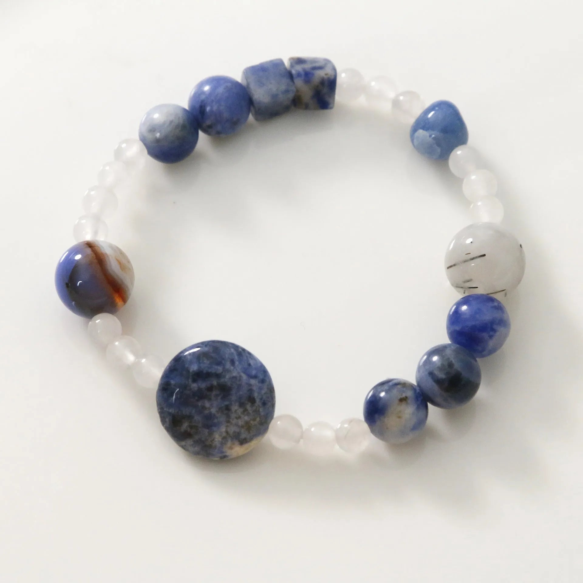 Hand-woven natural blue point and black hair crystal agate bracelet with geometric stone elements