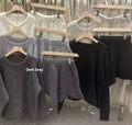 Women's loose-fitting long sleeve sweater and knitted wide leg shorts two-piece set in oatmeal colour.