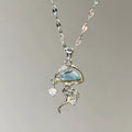 Blue jellyfish pendant necklace on adjustable sterling silver chain with white gold plating