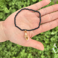 Handmade acrylic rice bead elastic bracelet in doll shape with flower detail, available in multiple colours