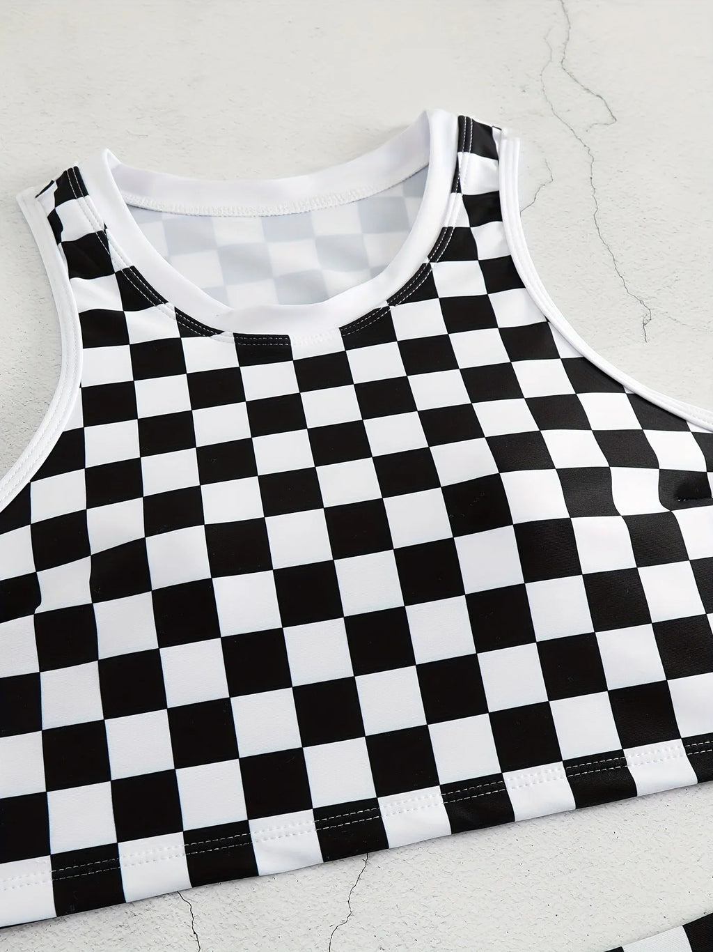Women's checkerboard pattern racing one-piece swimsuit with backless design and suspender straps