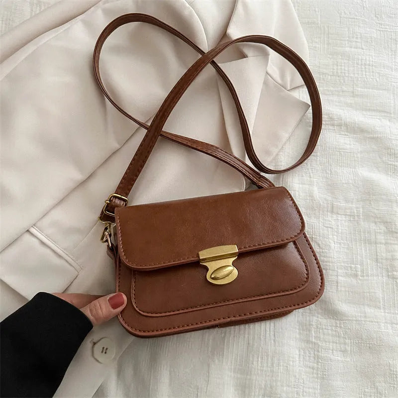 Soft PU leather small square handbag in horizontal rectangular shape showing black colour option