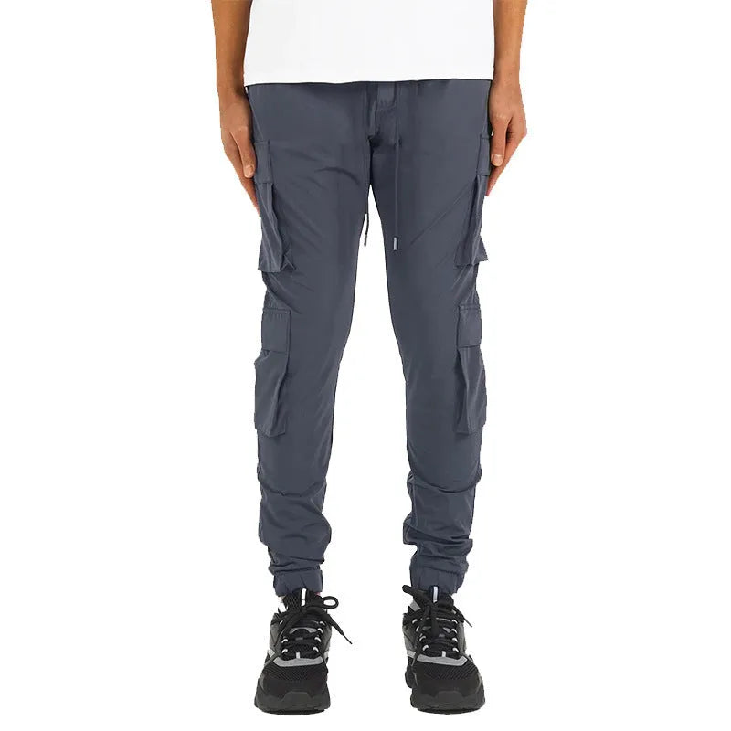 Men's stretch nylon ankle banded slacks in black, side view, plain colour design