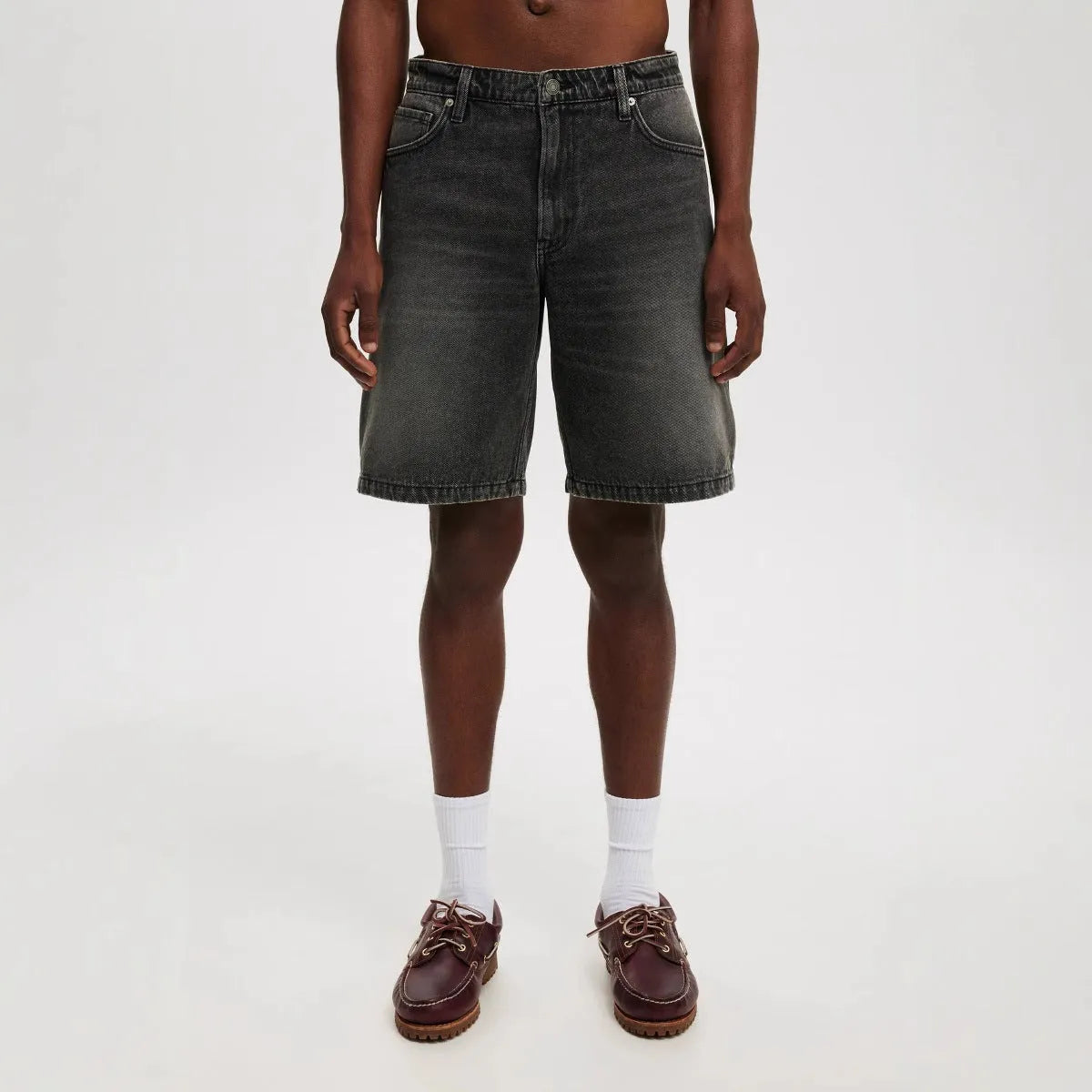 Men's loose fit straight-leg jeans trousers in light blue, black, and grey cotton denim.