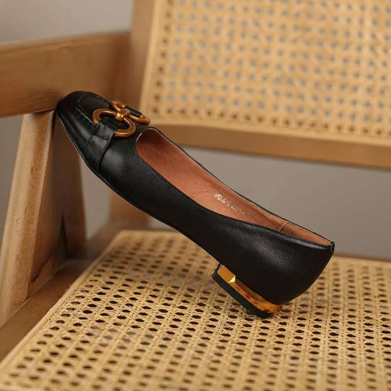 Low heel Mary Jane pumps with square toe, shallow mouth cut, and metal flat detail in Wanwan Lei style