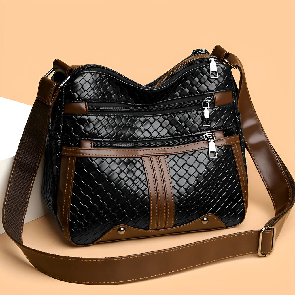 Brown woven PU messenger bag with single shoulder strap, showing multi-compartment interior with zippered change purse