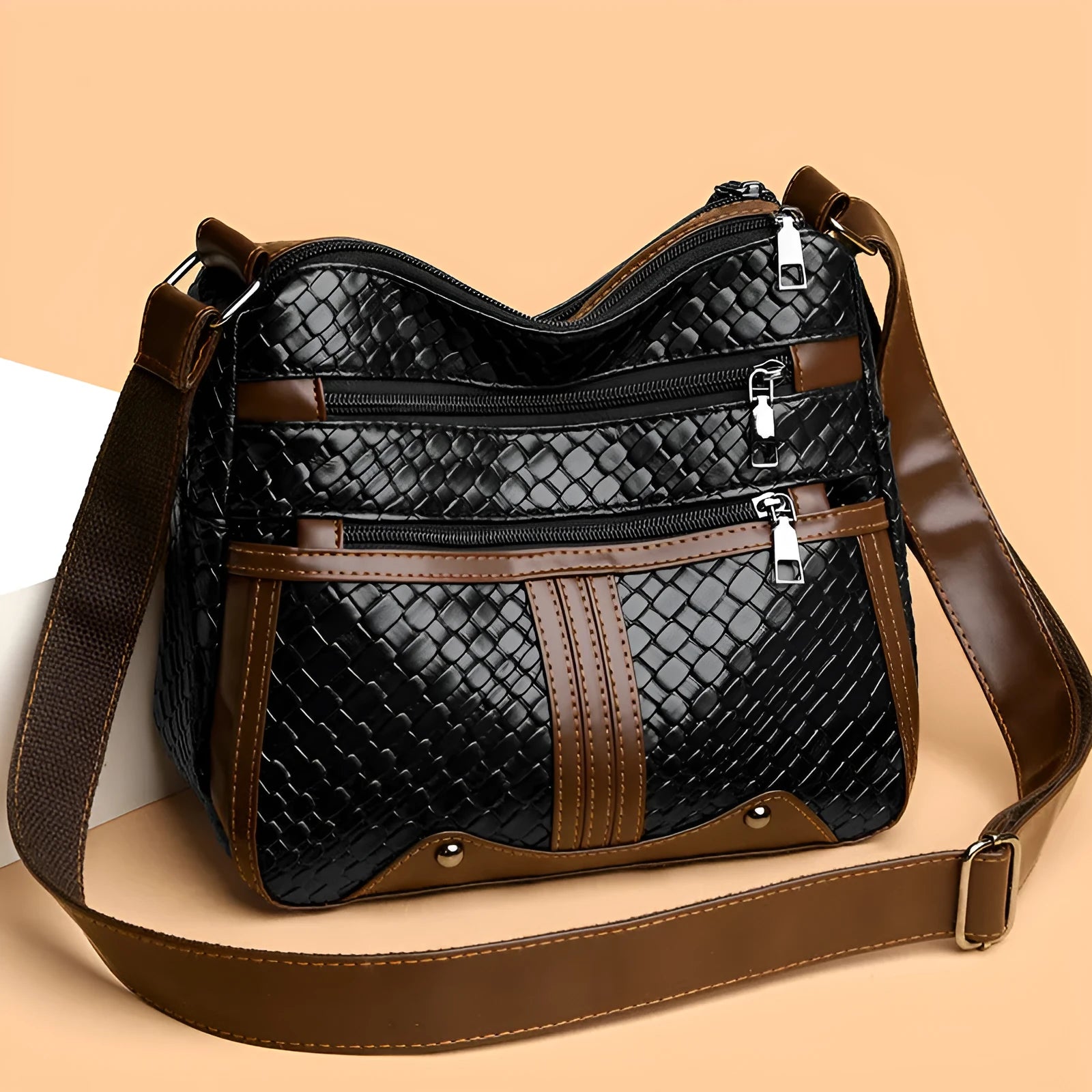 Brown woven PU messenger bag with single shoulder strap, showing multi-compartment interior with zippered change purse