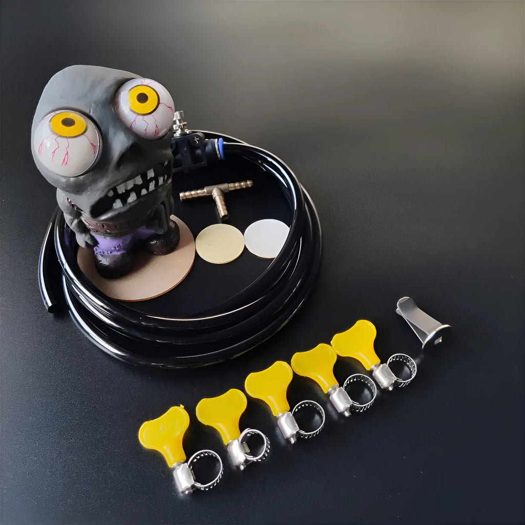 Turbo car blow-off valve kit with rubber doll ornament, pressure regulator, copper tube, and mounting clips.