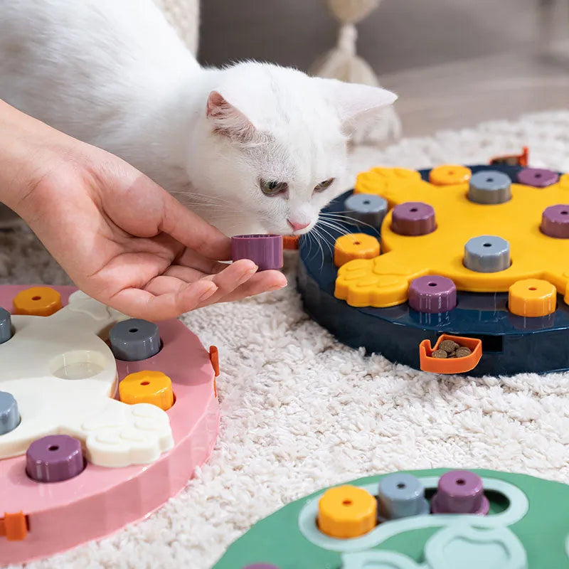 Blue interactive slow feeder dog bowl with puzzle channels, 28 cm diameter, on a wooden floor.