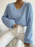 Women's solid colour long sleeve pullover top in a casual loose fit.