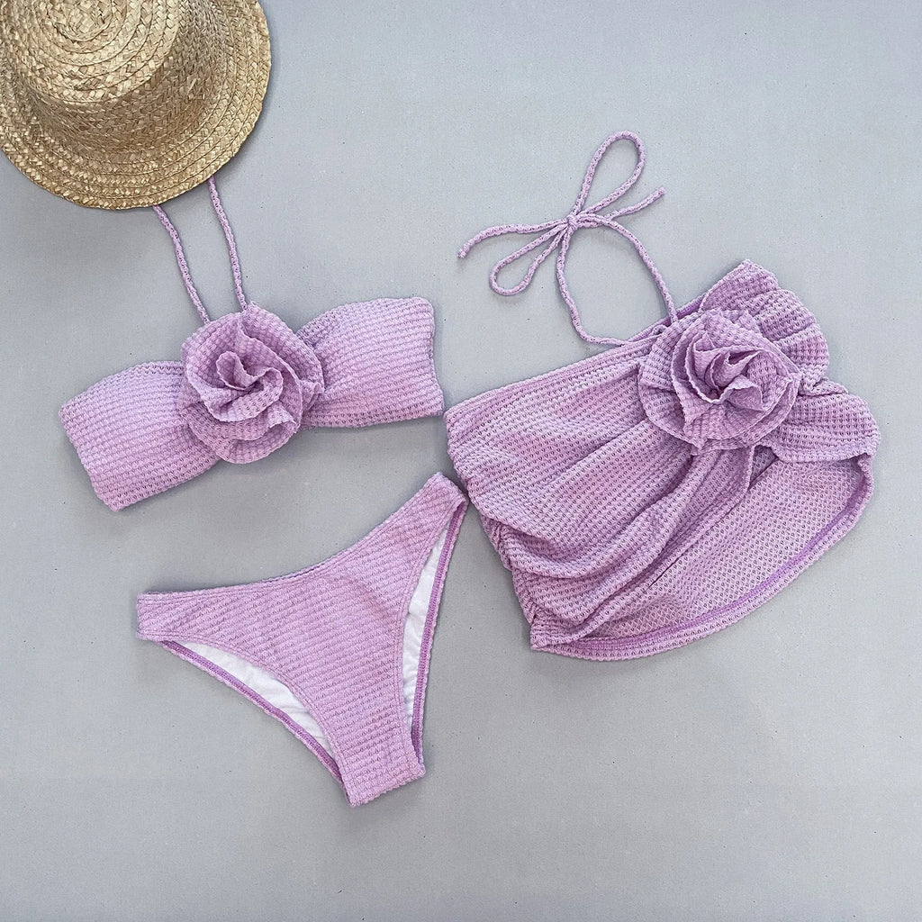Women's purple three-piece bikini set with 3D flower design for swimming