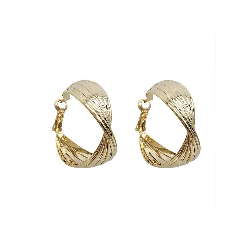 Twisted metal eardrop earring with real gold plating, geometric round shape, and stranded multi-layer design in gold colour