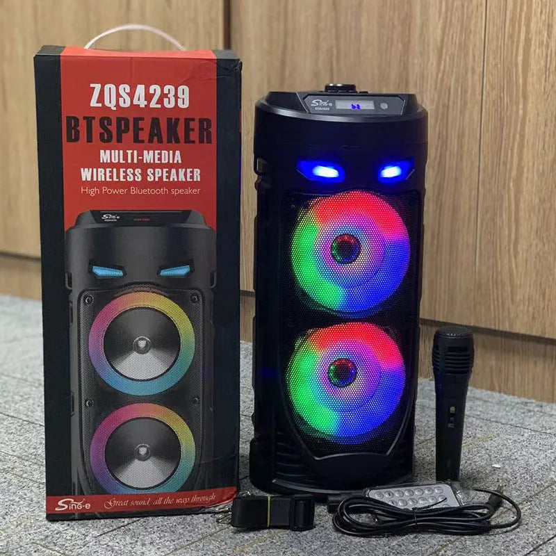 Black portable Bluetooth speaker with dual horn design and MP3 card slot on desktop