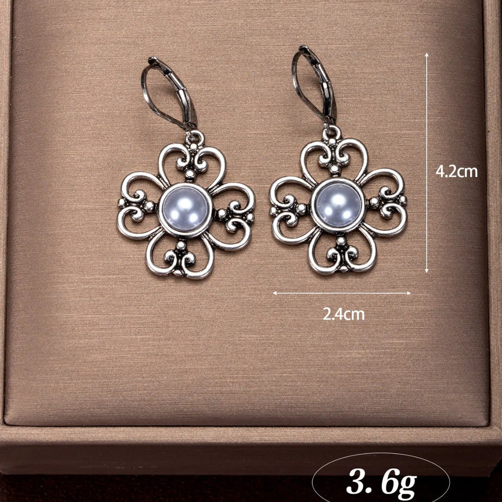 Women's gold-plated retro earrings with inlaid pearl in burnt silver colour