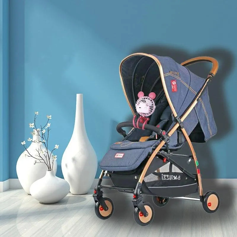 Pink USB rechargeable octopus stroller fan with flexible legs attached to a baby pushchair