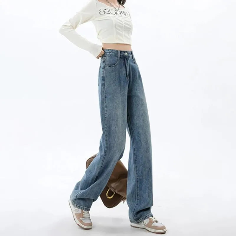 Woman wearing high-waisted retro blue wide leg jeans with a straight-leg cut.