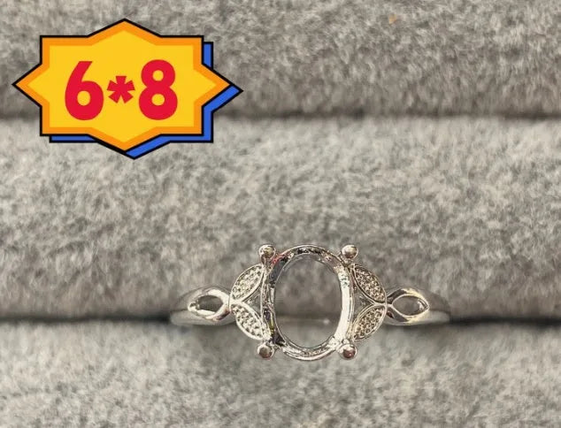 Oval denier ring with 6x8 mm stone and five-pointed star accent on open mouth copper band