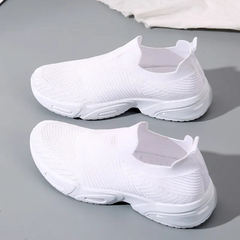 Slip-on breathable sock shoes in black, pink, khaki, and white with mesh lining and PVC sole.