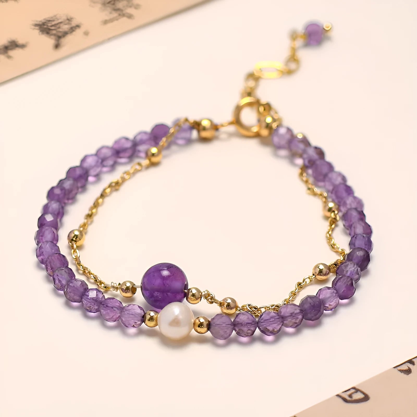 Chinese-style women's bracelet featuring genuine crystal and pearl beads with amethyst purple electroplated finish