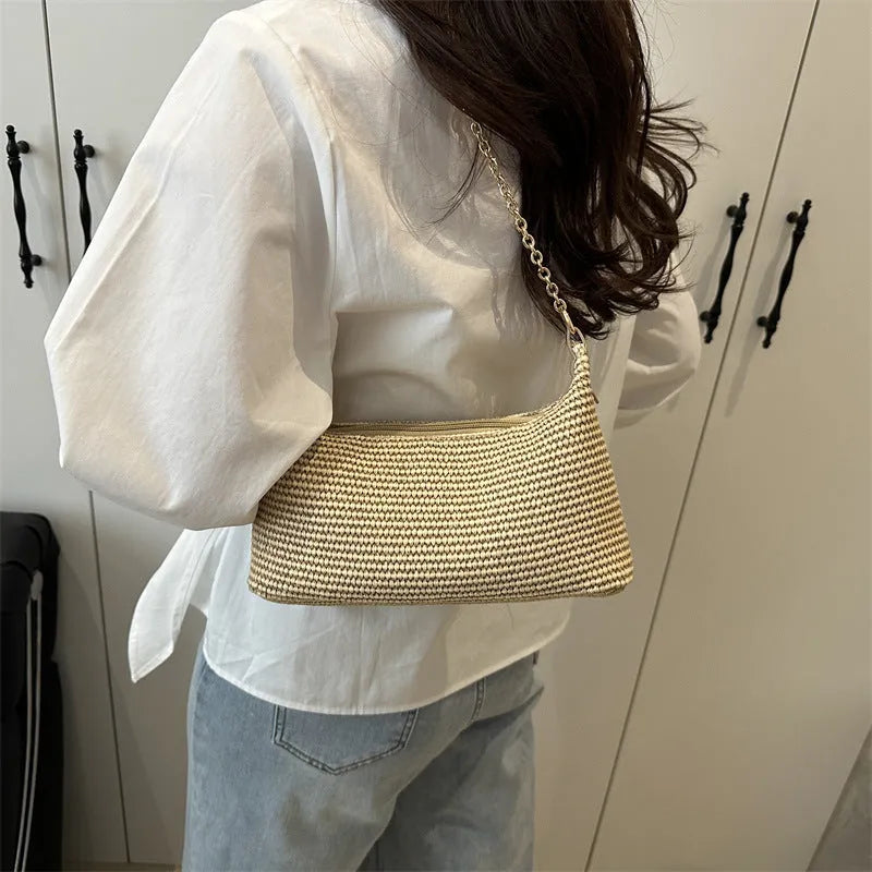 Woven straw shoulder tote bag in khaki colour with sandwich pocket design and internal phone compartment