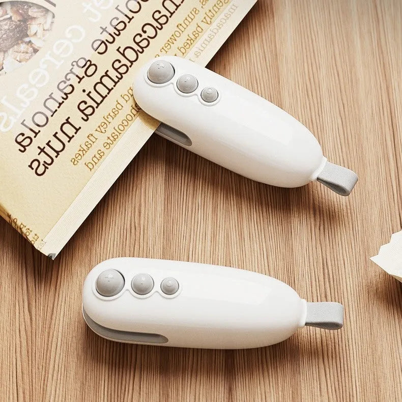 Household mini sealing machine automatic electric thermal capper in ivory white with compact ABS design