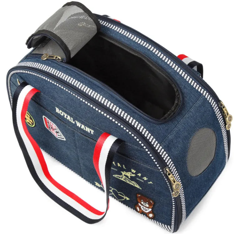 Blue denim pet carrier bag with cartoon pattern measuring 43cm by 20cm by 30cm