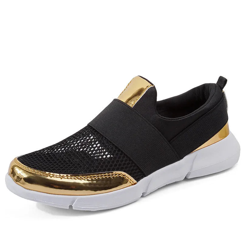 Low-cut blue, black, and grey women's sneakers with a mesh interior on a plain background.