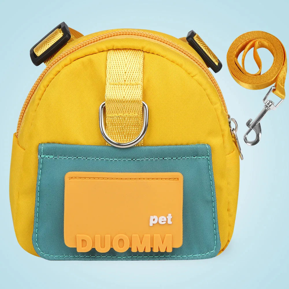 Blue adjustable dog harness backpack with breathable mesh panels and a tow rope attached.