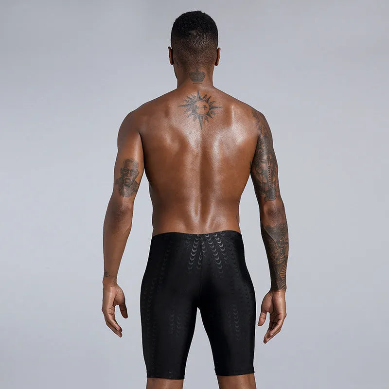 Men's solid colour polyester swimming trunks for beach surfing and swimming, shown in larger sizes.