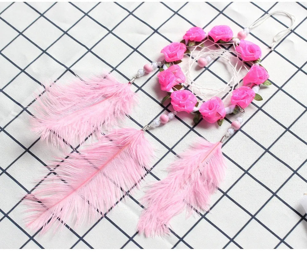 Pink ostrich feather dreamcatcher wind chime wall ornament measuring 10cm