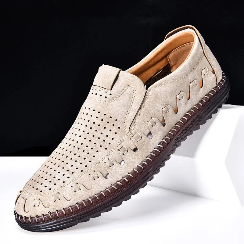 Men's brown casual slip-on shoes with round toe, low top, and sleeve entry design on a plain background.